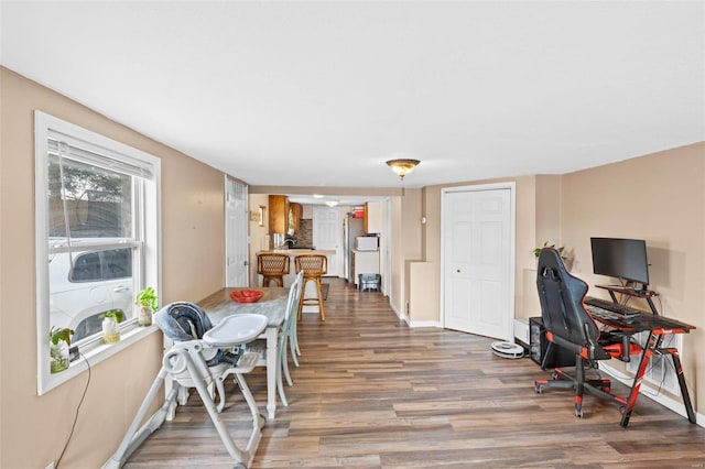 dining room with hardwood / wood-style flooring