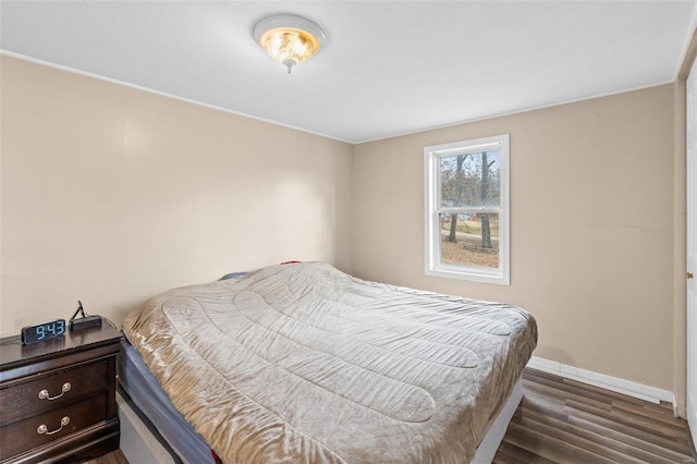 bedroom featuring dark hardwood / wood-style flooring