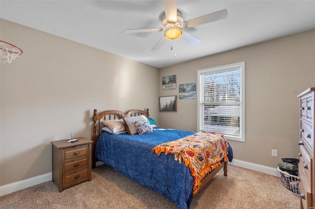 bedroom with ceiling fan and light colored carpet