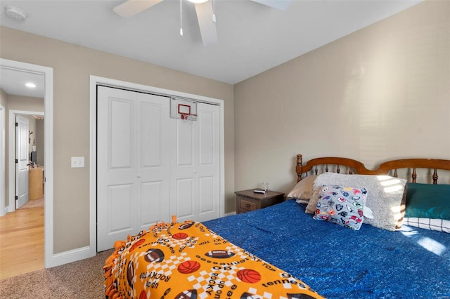 bedroom with ceiling fan, a closet, and carpet