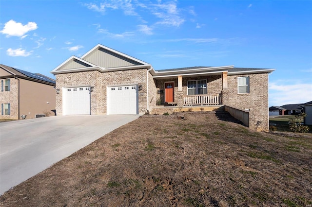 view of front of house with a garage and a porch