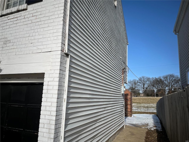 view of property exterior with a garage