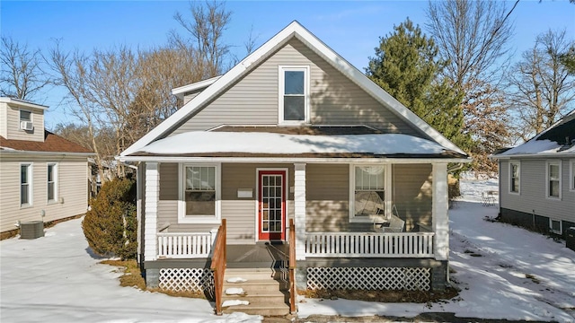 view of front of house featuring covered porch and cooling unit