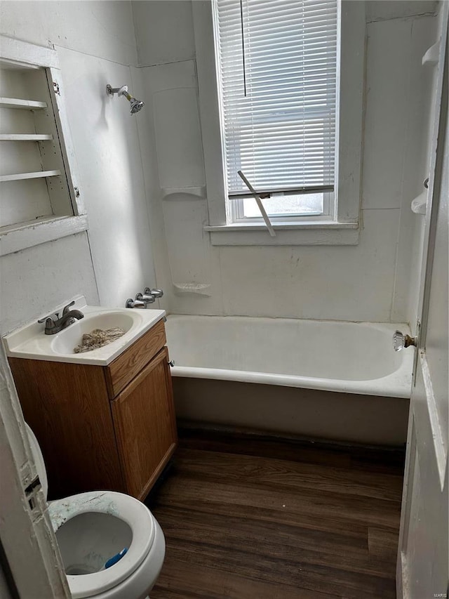 full bathroom featuring toilet, vanity, shower / tub combination, and hardwood / wood-style flooring