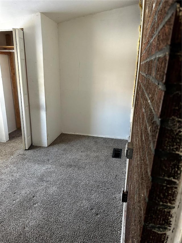 unfurnished bedroom with carpet