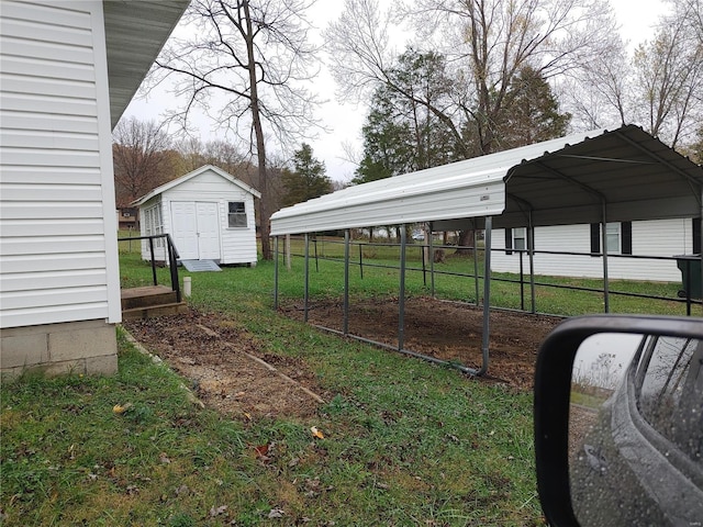 view of yard featuring a carport and a storage shed