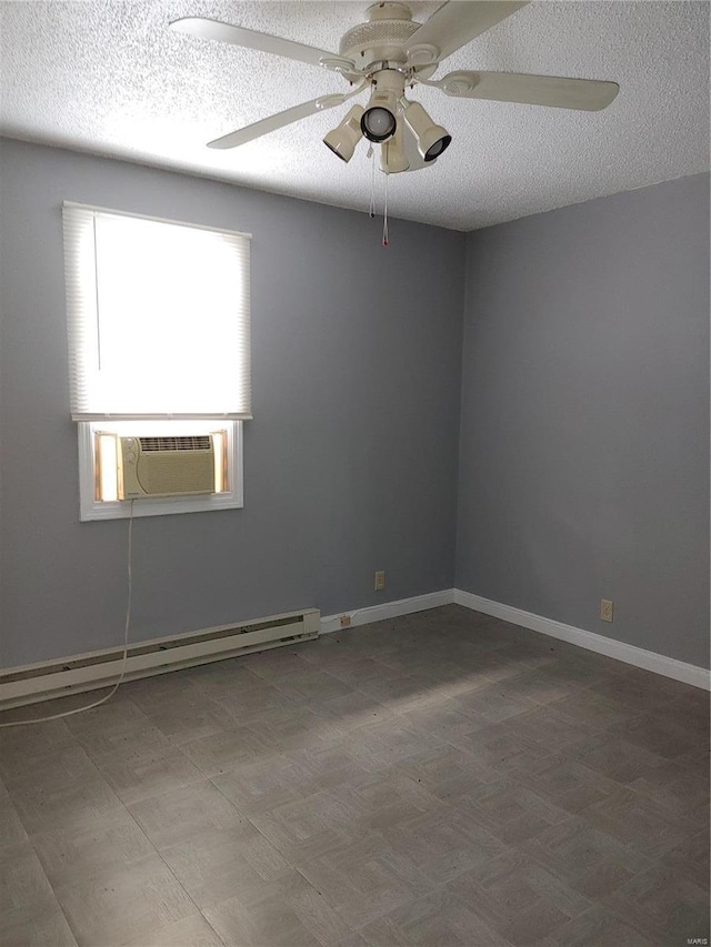 spare room with ceiling fan, cooling unit, a textured ceiling, and a baseboard heating unit