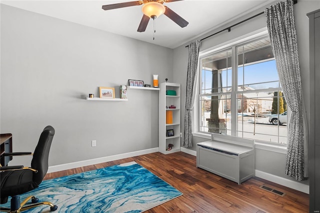 office with ceiling fan and dark hardwood / wood-style flooring