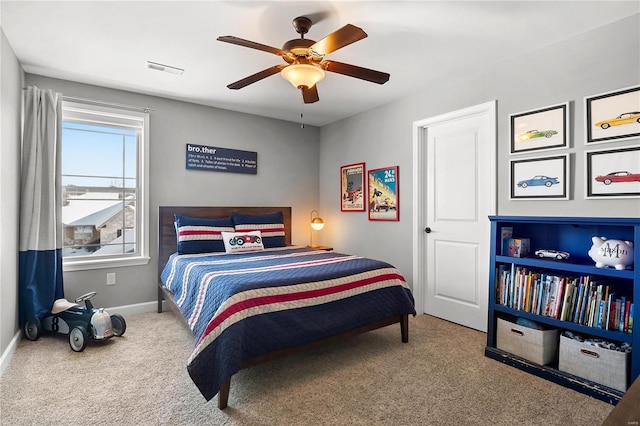 carpeted bedroom with ceiling fan