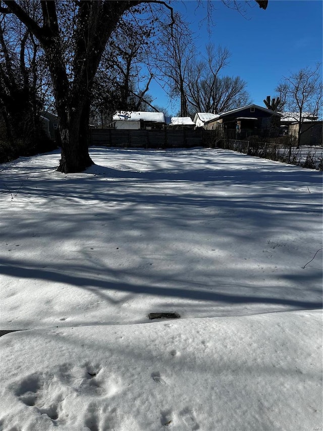 view of yard layered in snow