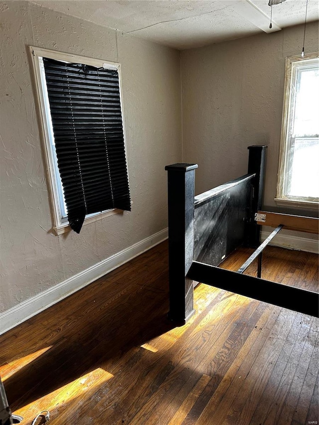 bedroom with hardwood / wood-style floors