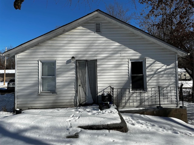 view of snow covered house