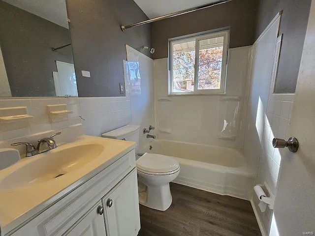 full bathroom with backsplash, vanity, bathing tub / shower combination, wood-type flooring, and toilet