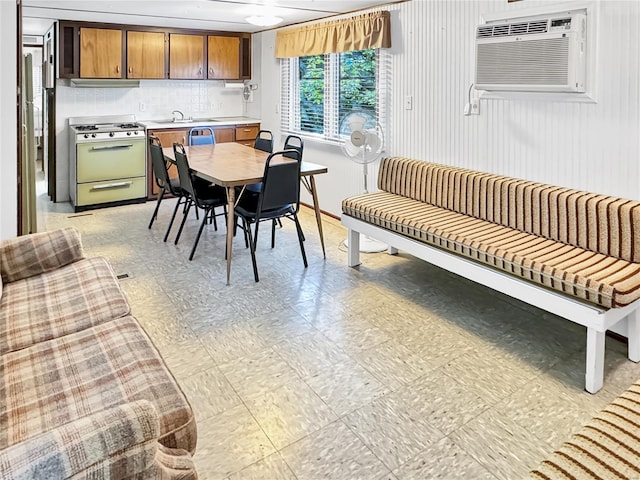 dining space with a wall mounted air conditioner