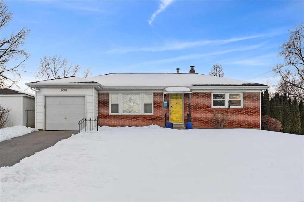 single story home featuring a garage