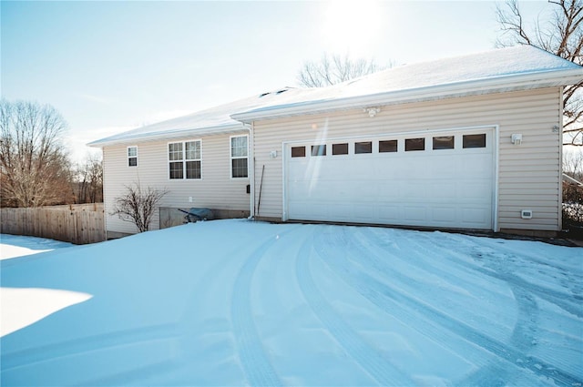 ranch-style house featuring a garage