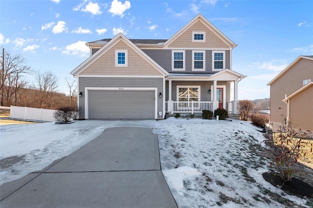 view of front of home with a garage and covered porch