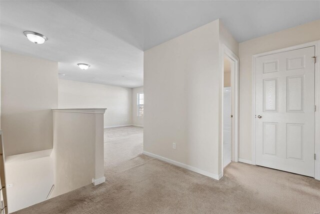 interior space featuring light colored carpet