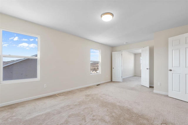 unfurnished bedroom with light carpet