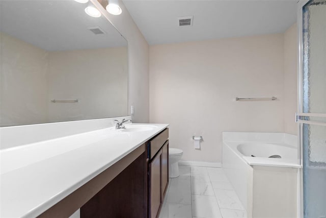 bathroom with vanity, toilet, and a bathing tub