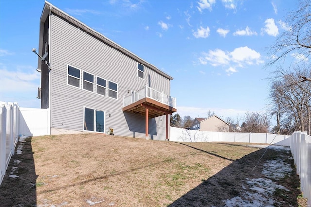 rear view of property with a lawn