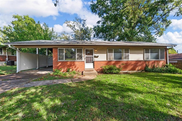 single story home featuring a carport and a front lawn