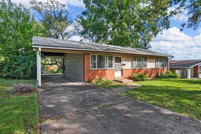 ranch-style house featuring a front lawn and a carport