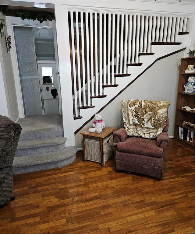 stairway featuring hardwood / wood-style flooring