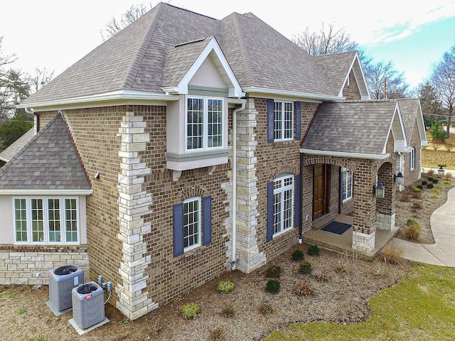 view of home's exterior with central AC