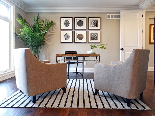 sitting room featuring dark wood-type flooring and ornamental molding