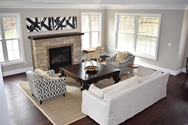 living room featuring a stone fireplace, ornamental molding, and dark hardwood / wood-style floors