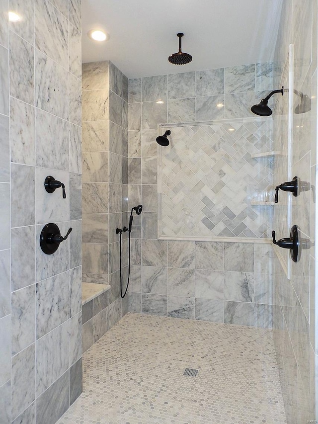 bathroom with a tile shower