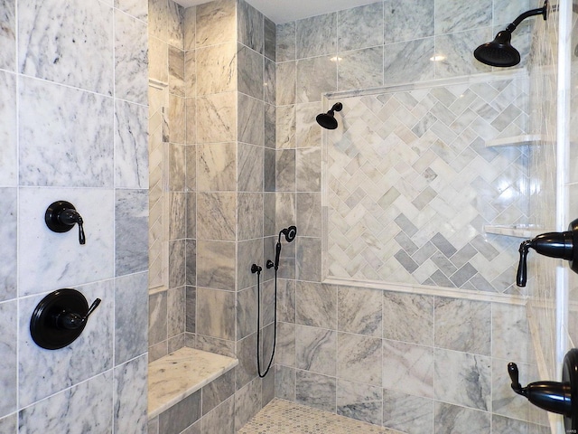 bathroom featuring a tile shower