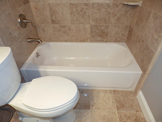 bathroom with a bathing tub and toilet