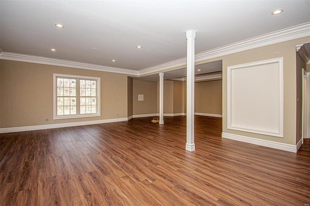 basement with dark hardwood / wood-style flooring and crown molding