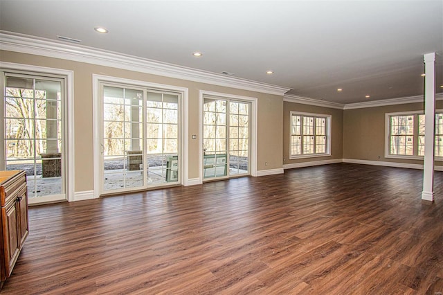 unfurnished living room featuring dark wood-type flooring and ornamental molding