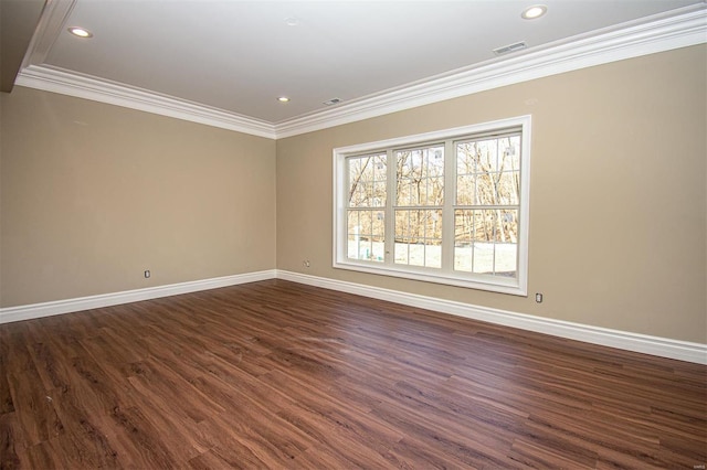 unfurnished room featuring ornamental molding and dark hardwood / wood-style floors