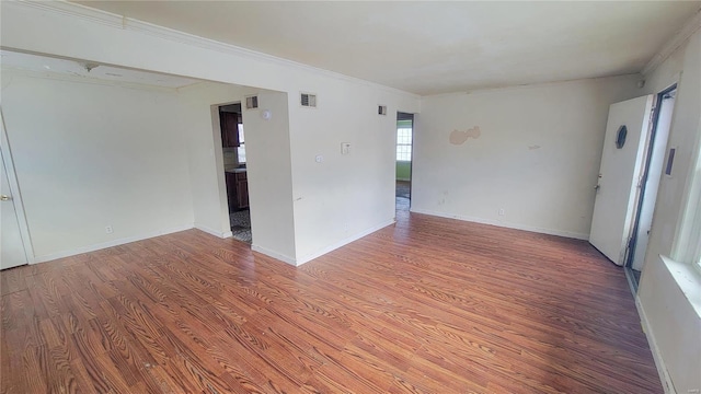 unfurnished room with hardwood / wood-style floors