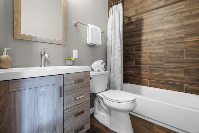 full bathroom featuring vanity, shower / tub combo, and toilet