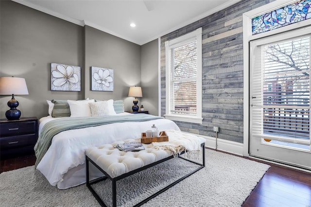 bedroom featuring ceiling fan, ornamental molding, dark hardwood / wood-style floors, and access to outside