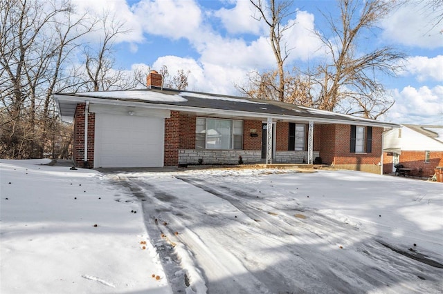 ranch-style home featuring a garage