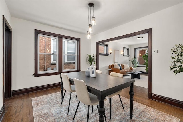 dining area with dark wood-type flooring