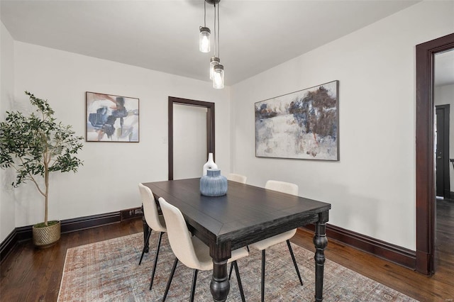 dining room with dark hardwood / wood-style flooring