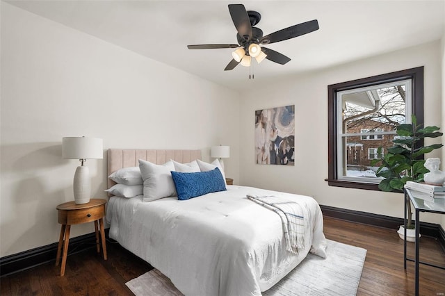 bedroom featuring ceiling fan and dark wood-type flooring