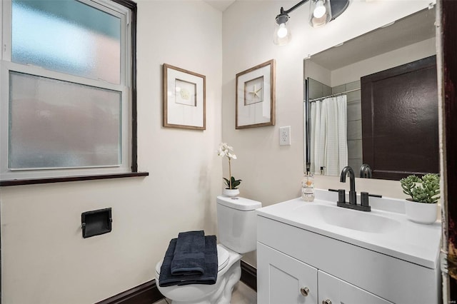 bathroom with toilet and vanity