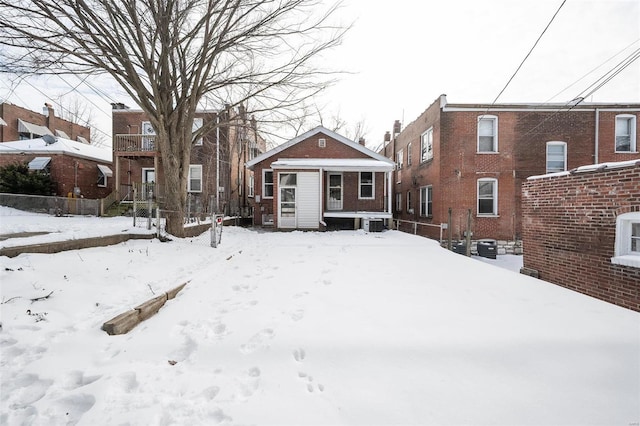 snowy yard with central air condition unit