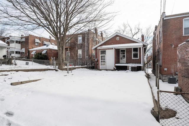 yard covered in snow with central AC unit