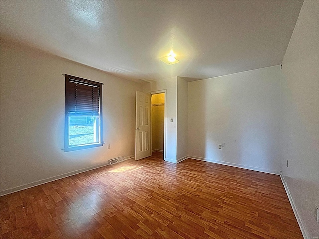 empty room featuring wood-type flooring