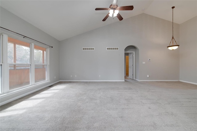 unfurnished room with high vaulted ceiling, light colored carpet, and ceiling fan