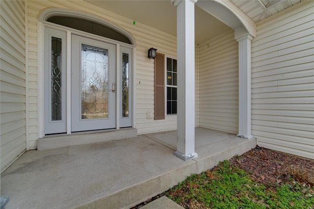 entrance to property featuring a porch